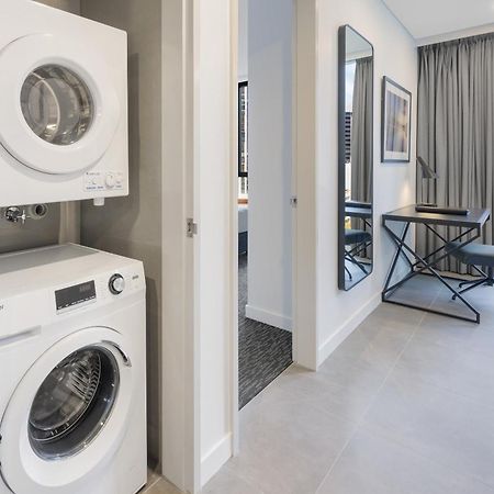 Meriton Suites Мельбурн Экстерьер фото Laundry facilities in a typical apartment